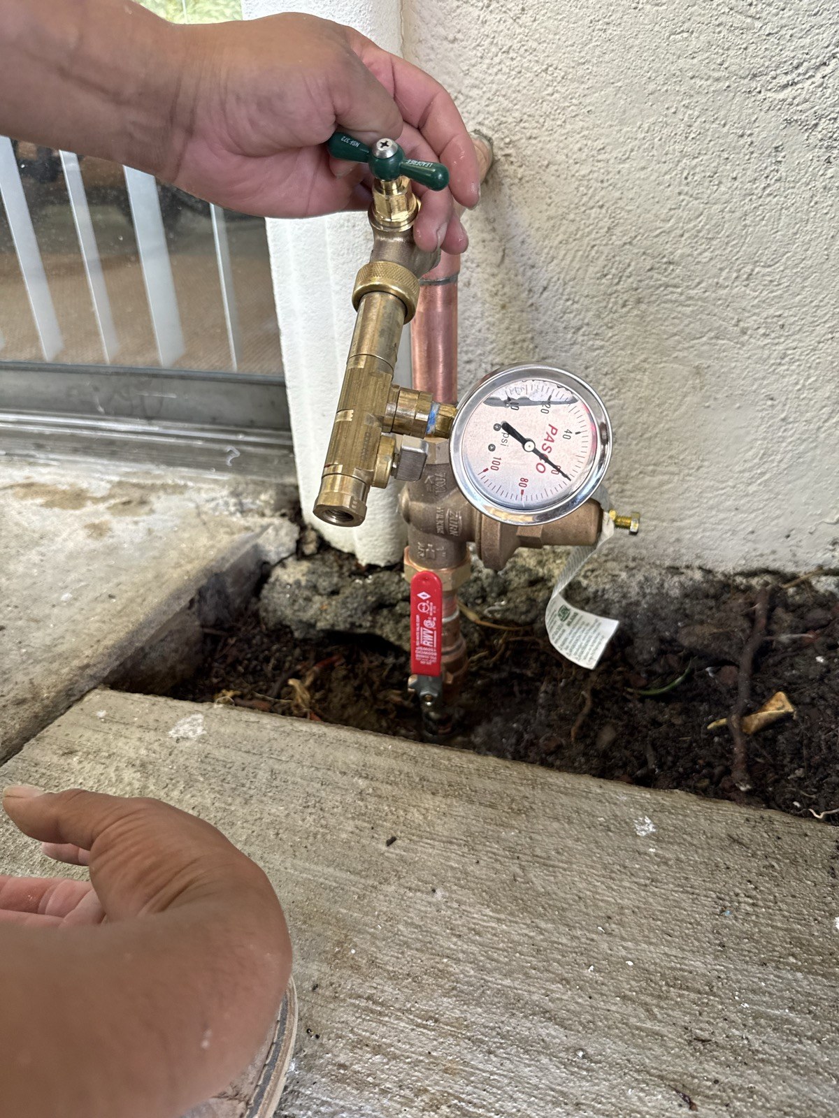 Technician adjusting a pressure regulator